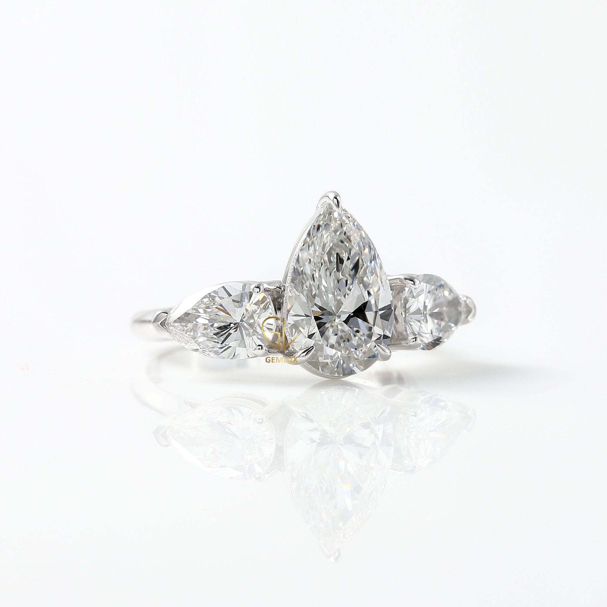 3 Ct Pear Cut Lab Grown Diamond Three Stone Ring