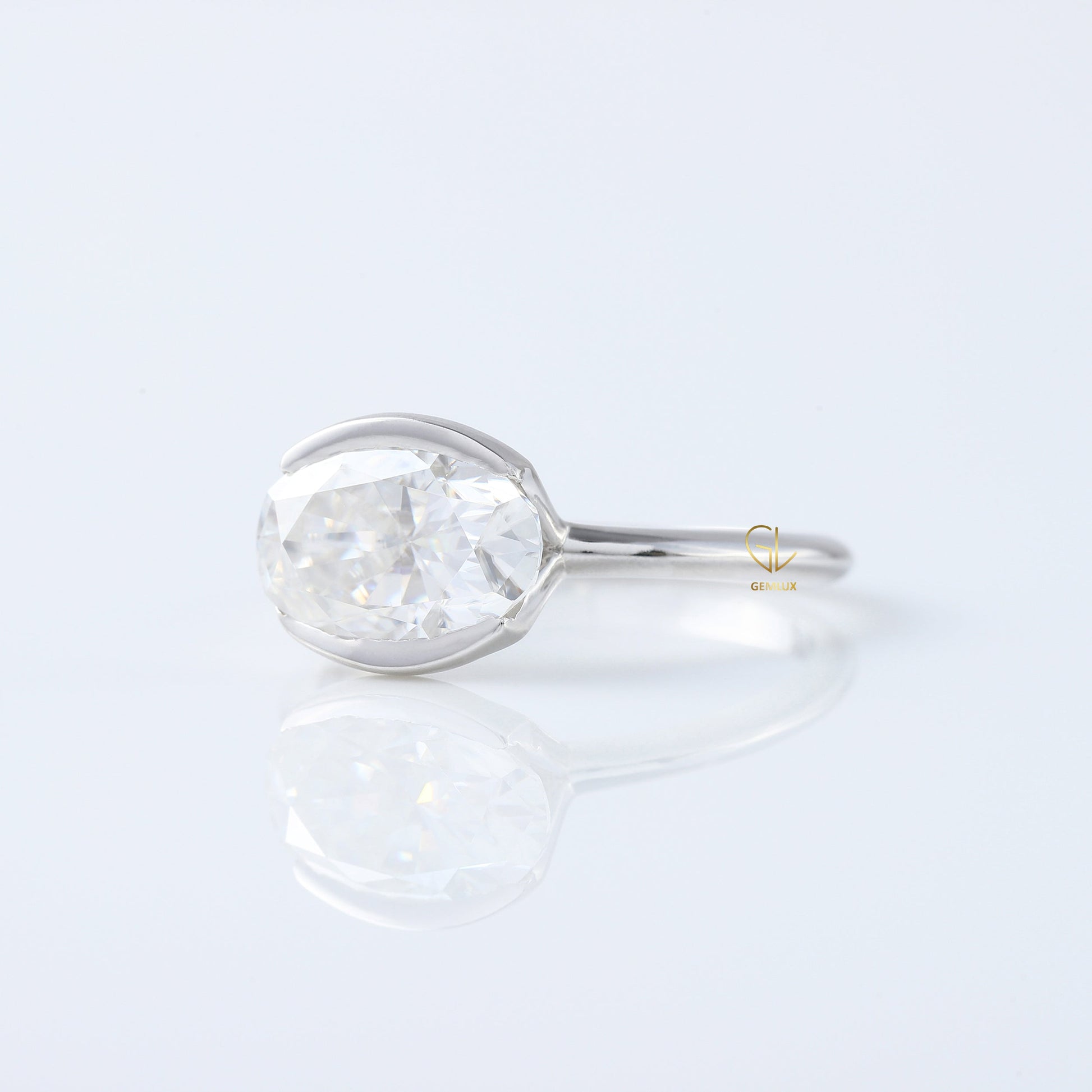 East West Oval Lab Grown Diamond Solitaire Ring - Half Bezel