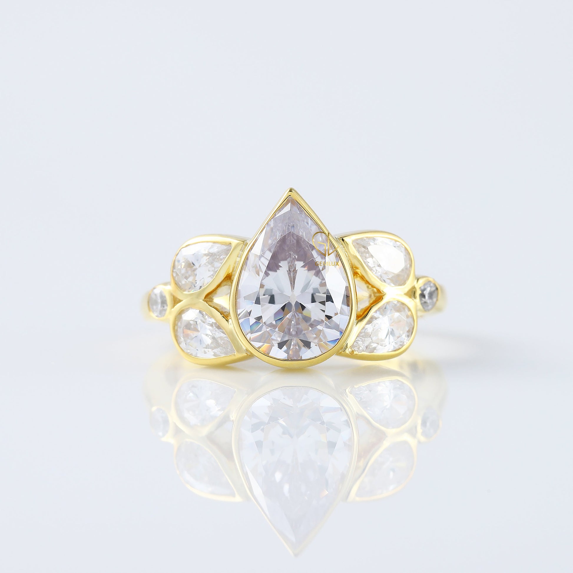 Seven Stone Pear Cut Moissanite Bezel Set Yellow Gold Ring