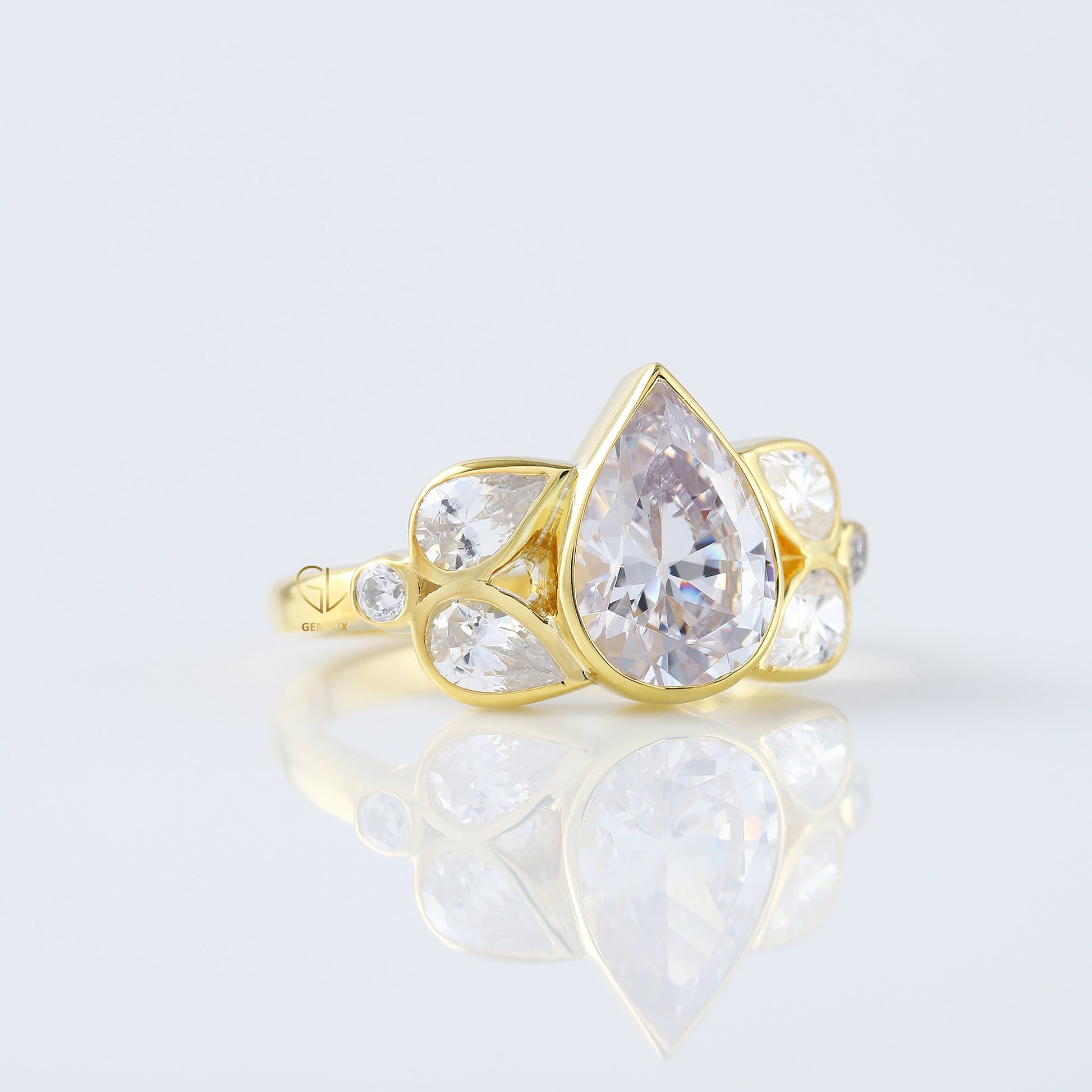 Seven Stone Pear Cut Moissanite Bezel Set Yellow Gold Ring