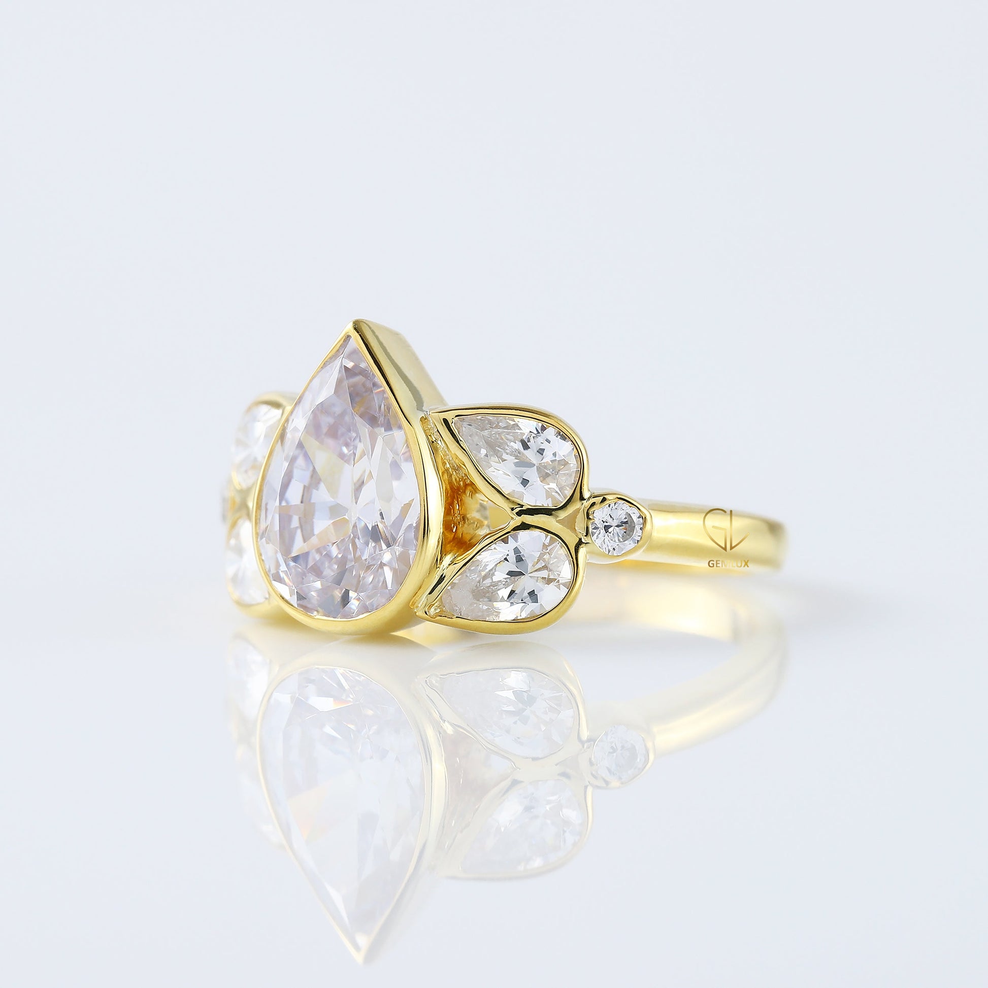 Seven Stone Pear Cut Moissanite Bezel Set Yellow Gold Ring